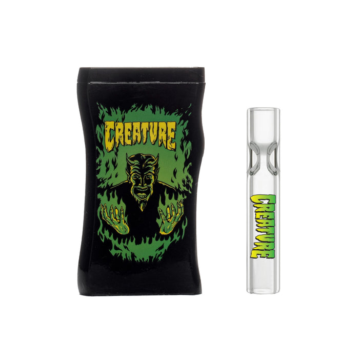 Creature Skateboards Fiery Hell Devil Design on a dugout with glass taster one-hitter